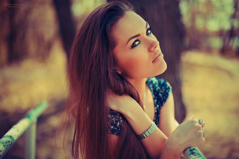 woman with long hair in park