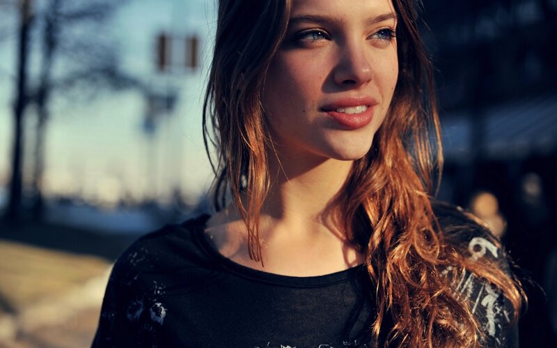 woman with long hair in sunlight