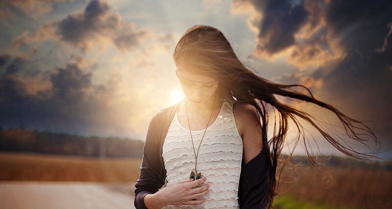 woman with long hair in sunset