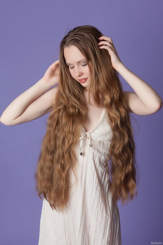 woman with long hair in white dress
