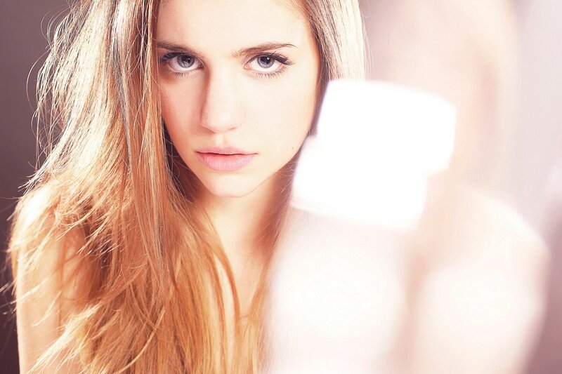 woman with long hair looking at camera