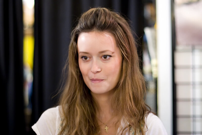 woman with long hair looking away