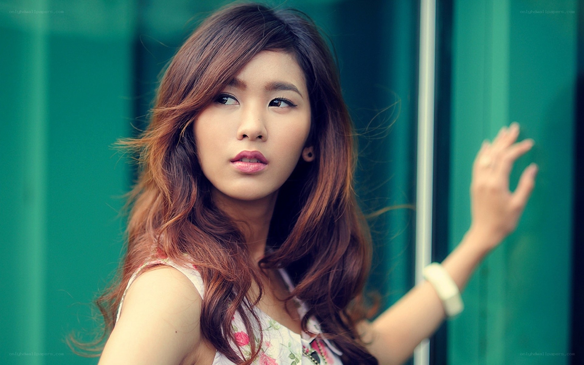 woman with long hair looking away