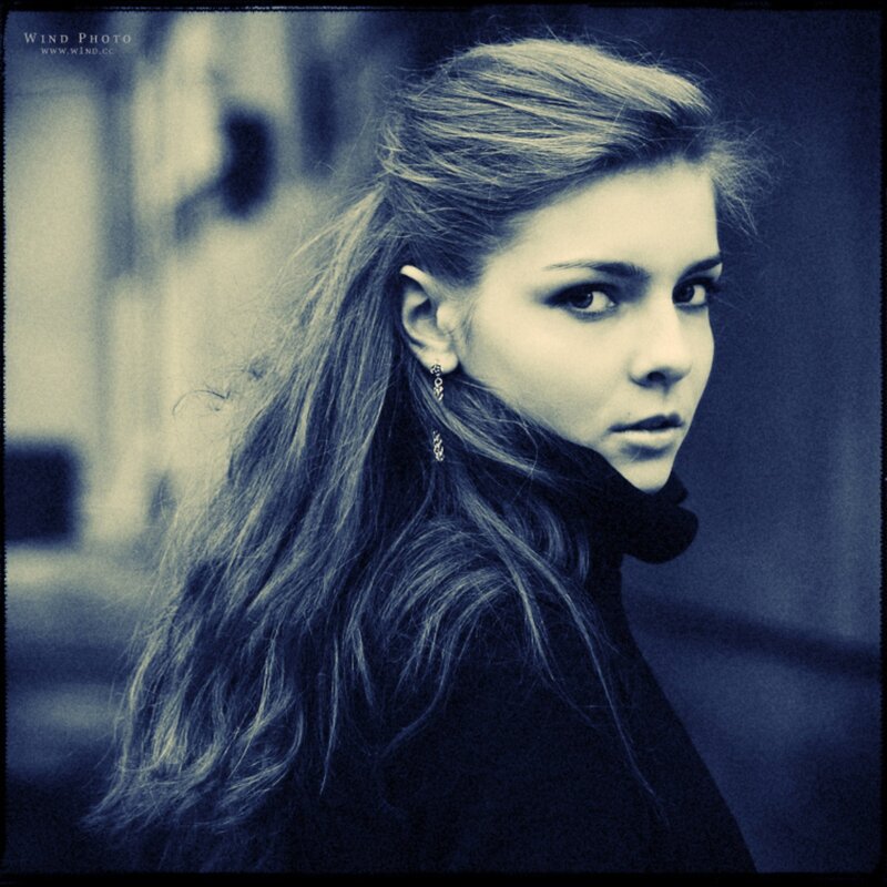 woman with long hair looking back