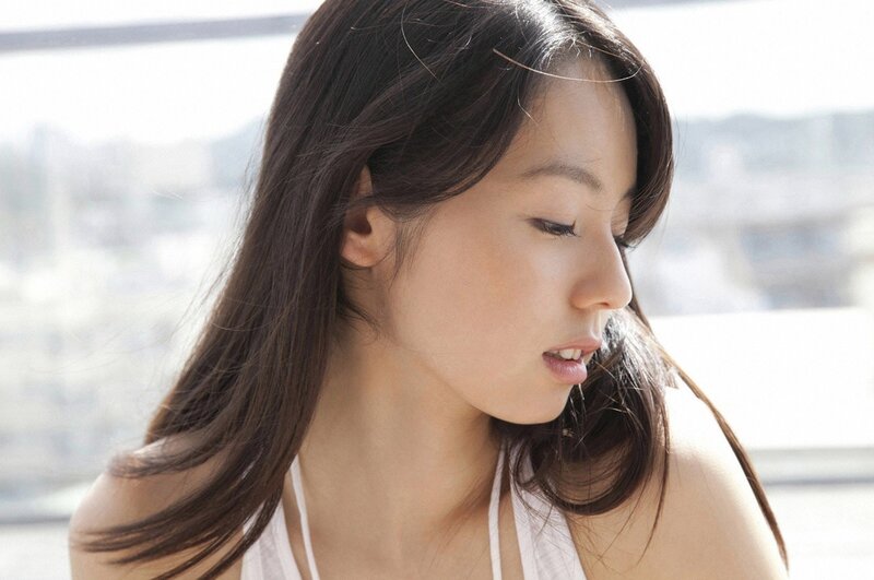 woman with long hair looking down