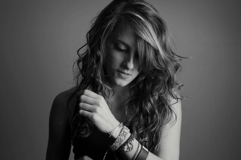 woman with long hair looking down