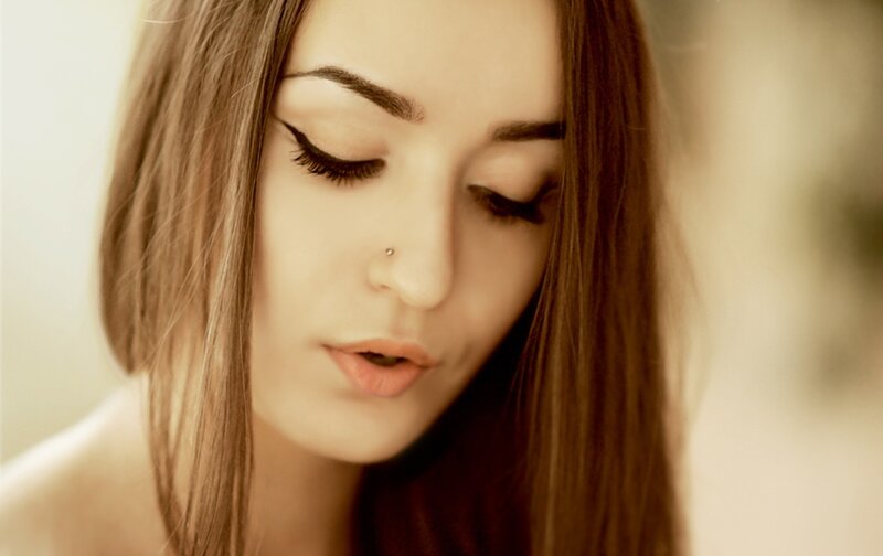 woman with long hair looking down