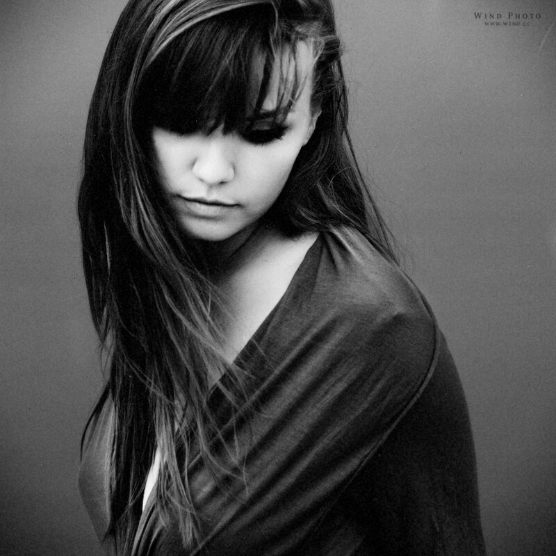 woman with long hair looking down