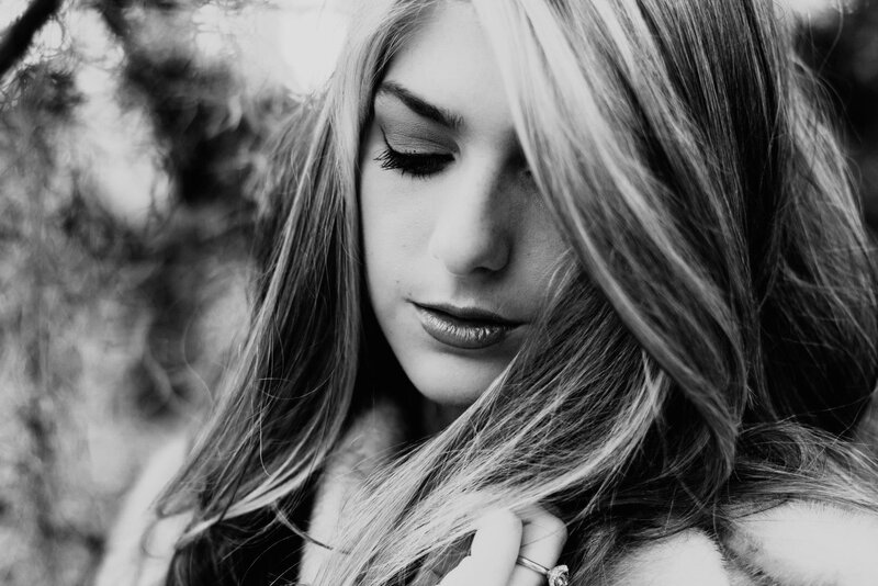 woman with long hair looking down