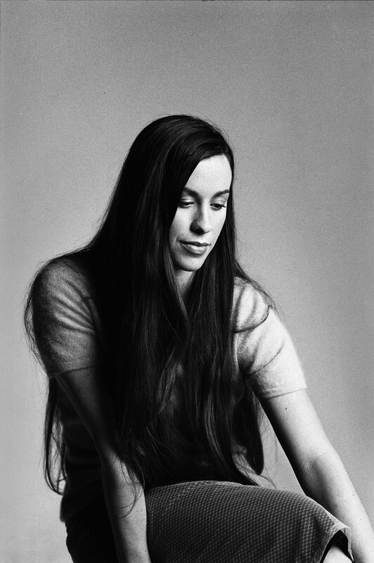 woman with long hair looking down