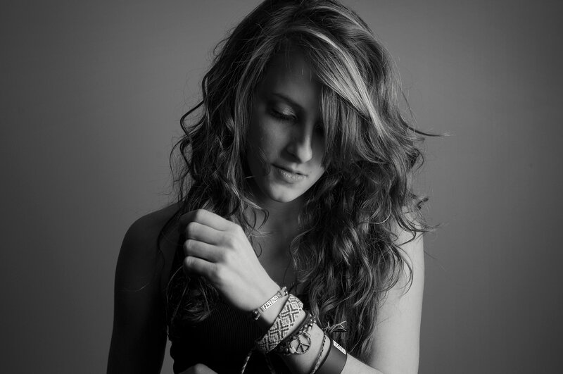 woman with long hair looking down