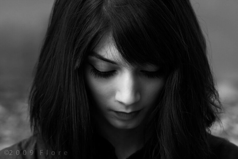 woman with long hair looking down