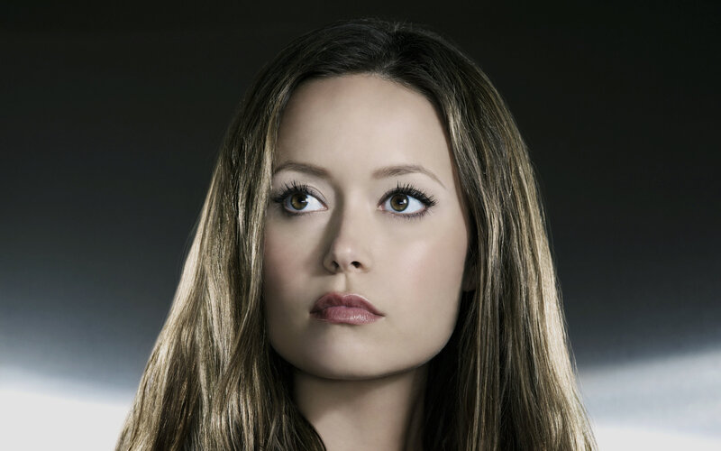 woman with long hair looking up