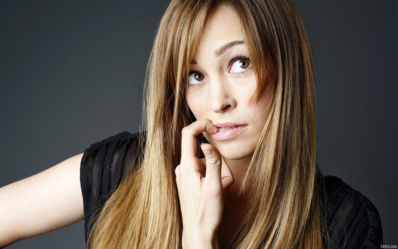 woman with long hair looking up