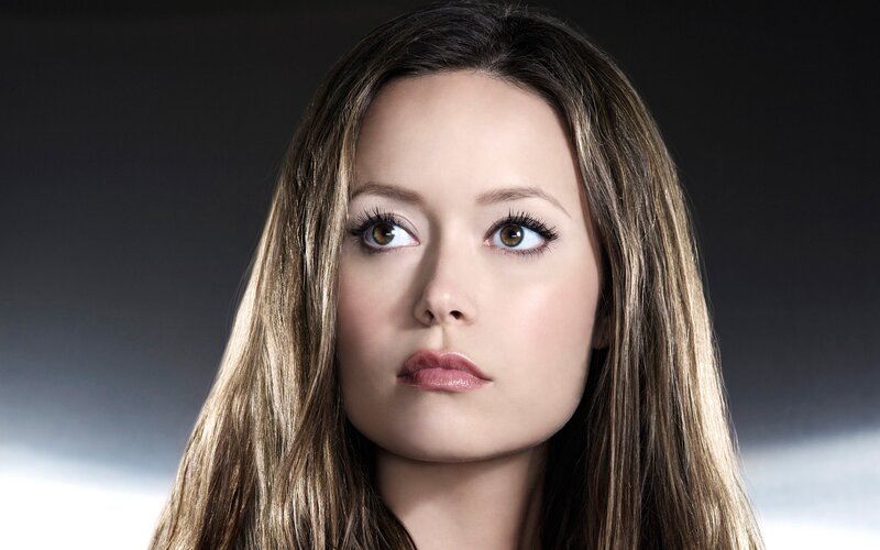 woman with long hair looking up