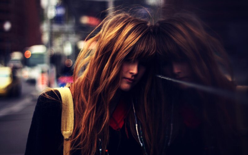 woman with long hair on street