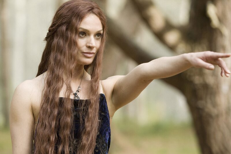 woman with long hair pointing
