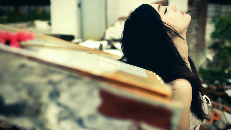 woman with long hair resting