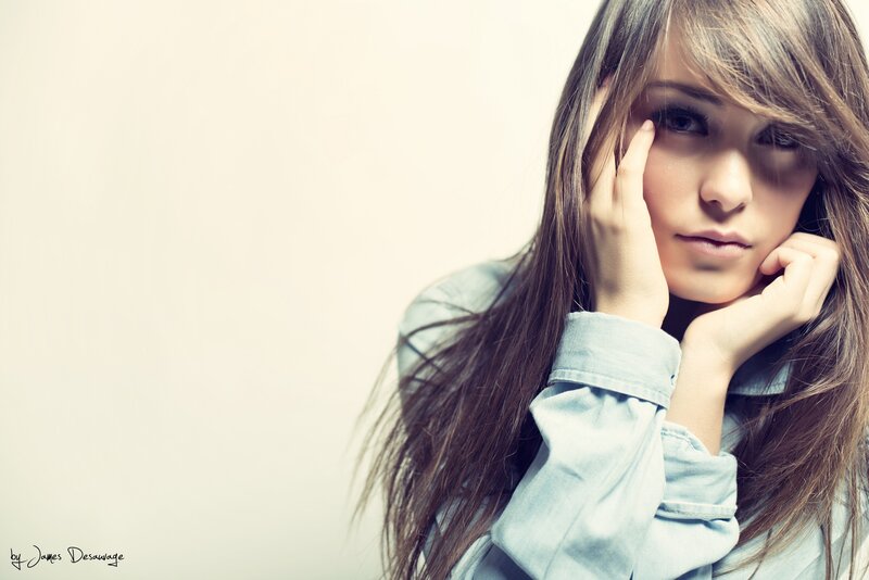 woman with long hair resting hands