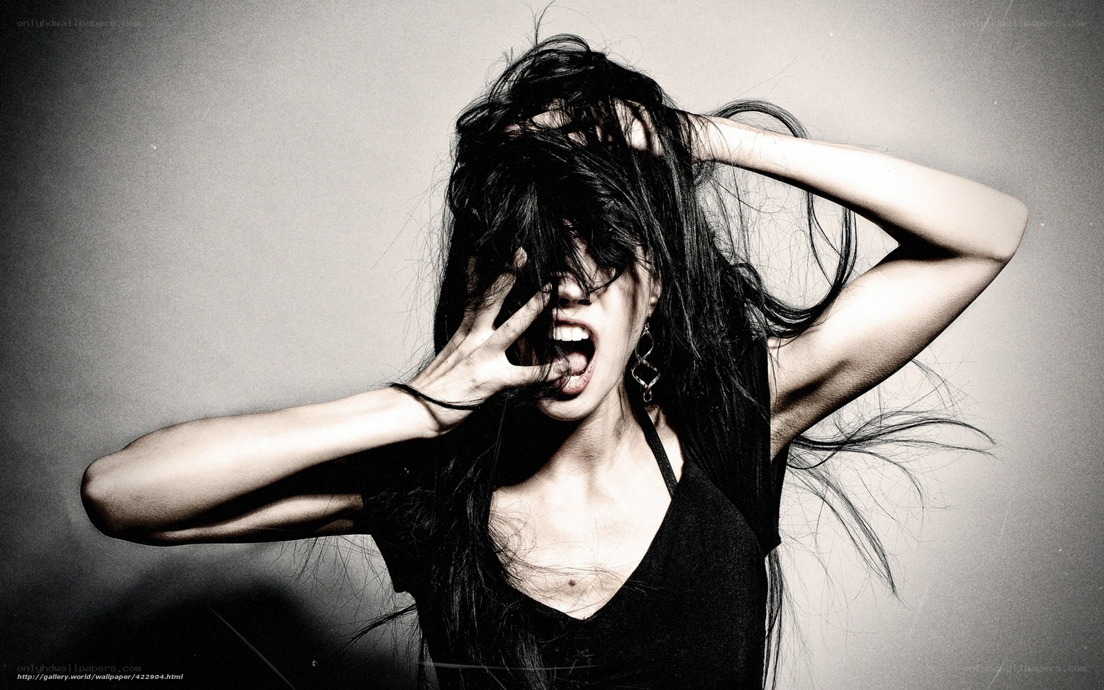 woman with long hair screaming