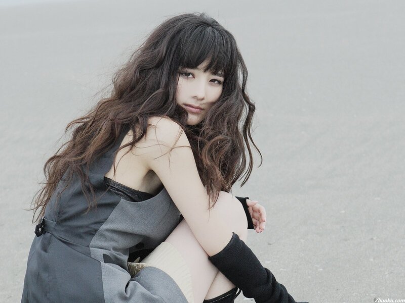 woman with long hair sitting