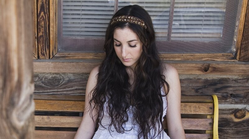 woman with long hair sitting