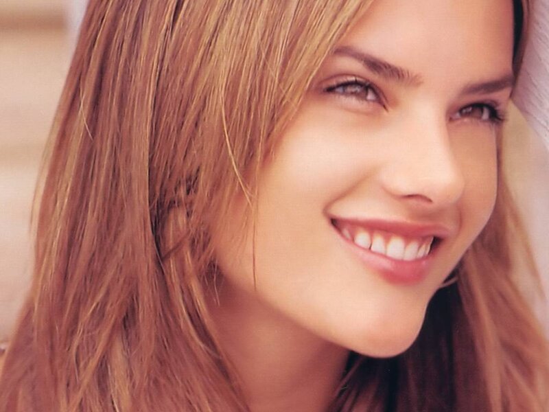 woman with long hair smiling