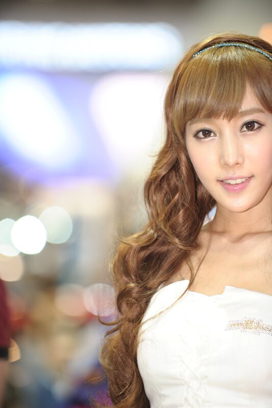 woman with long hair smiling