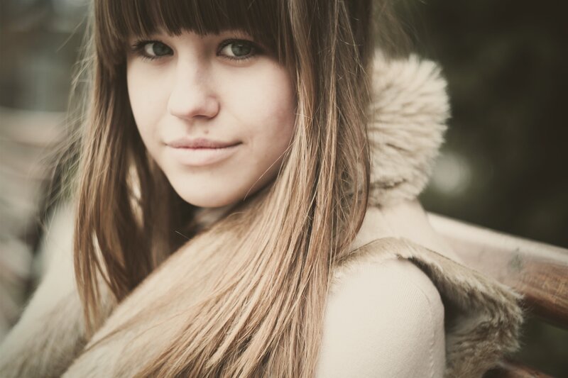 woman with long hair smiling
