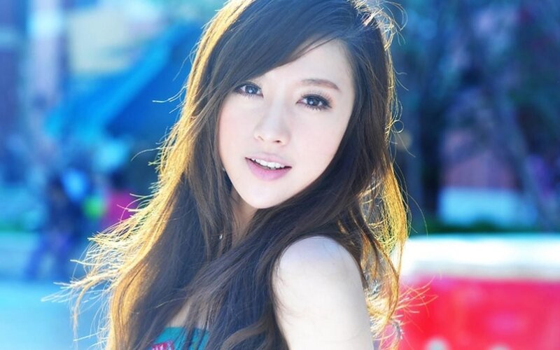 woman with long hair smiling