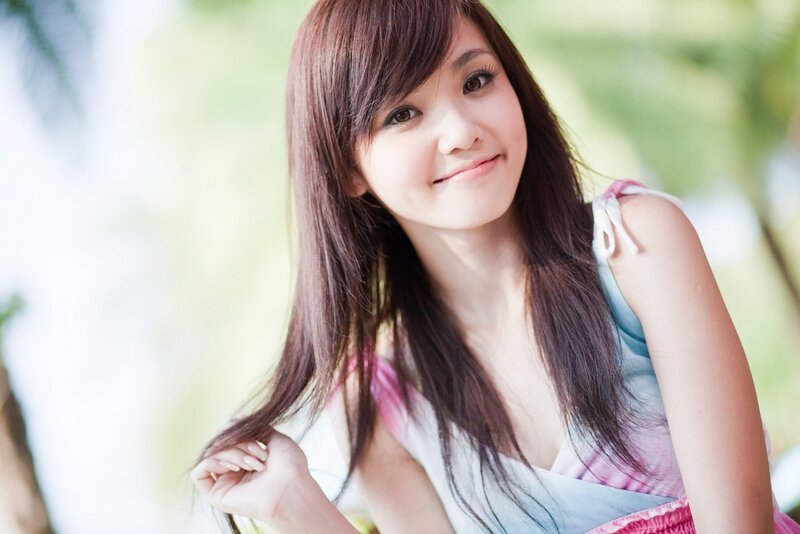 woman with long hair smiling