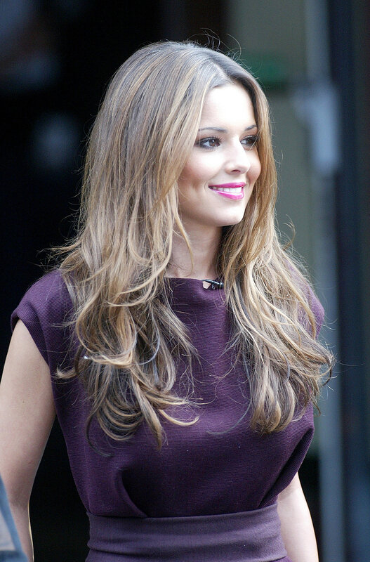woman with long hair smiling