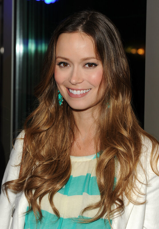 woman with long hair smiling