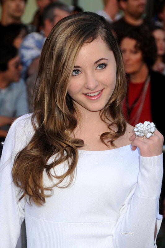 woman with long hair smiling