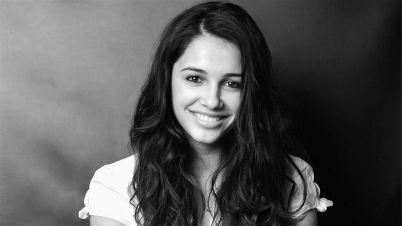 woman with long hair smiling
