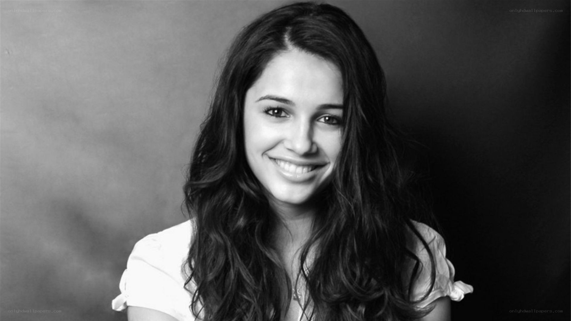 woman with long hair smiling