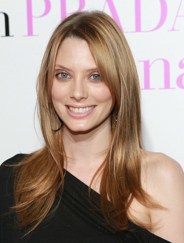 woman with long hair smiling