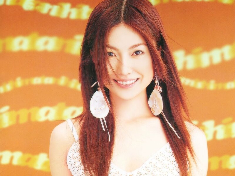 woman with long hair smiling
