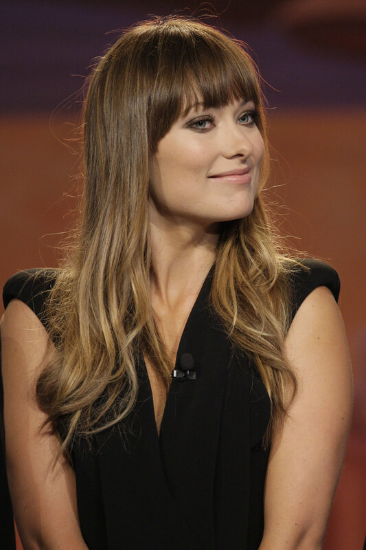 woman with long hair smiling