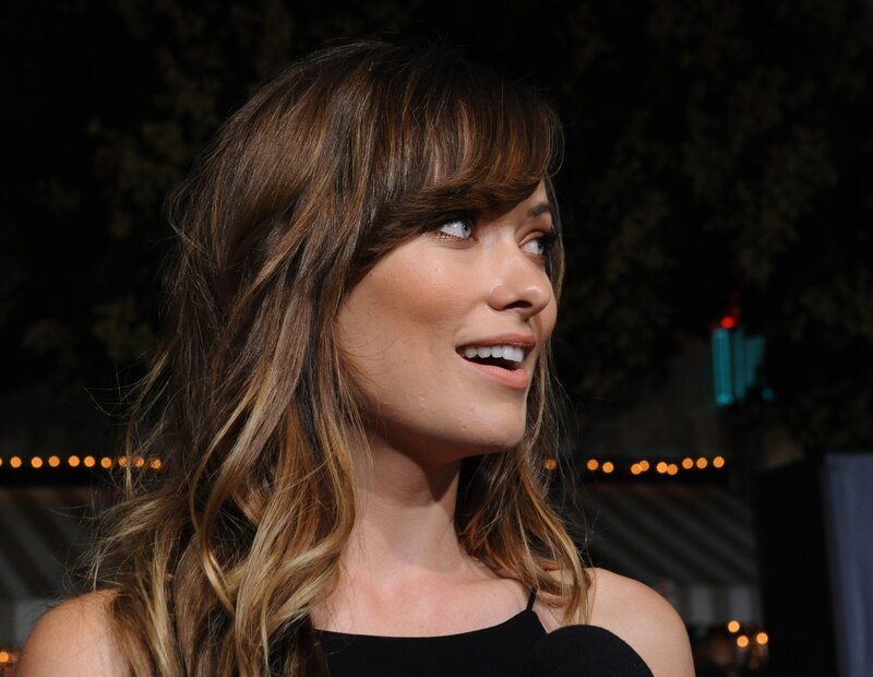 woman with long hair smiling
