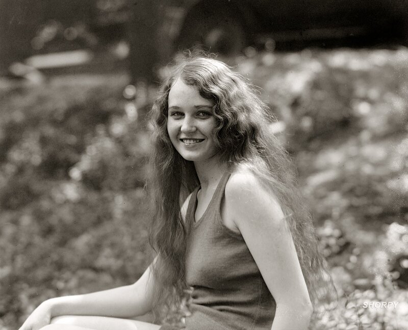 woman with long hair smiling