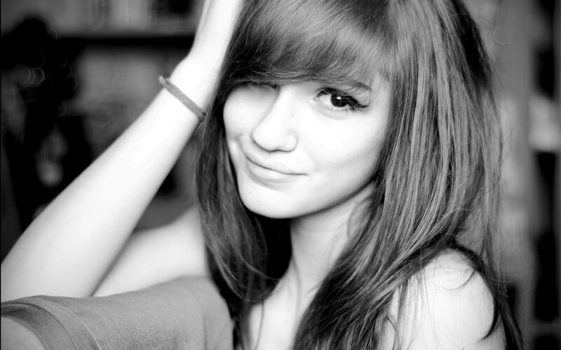 woman with long hair smiling