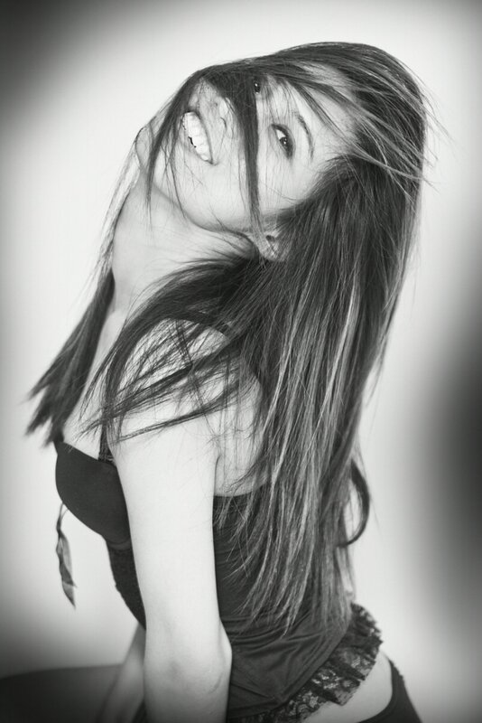 woman with long hair smiling