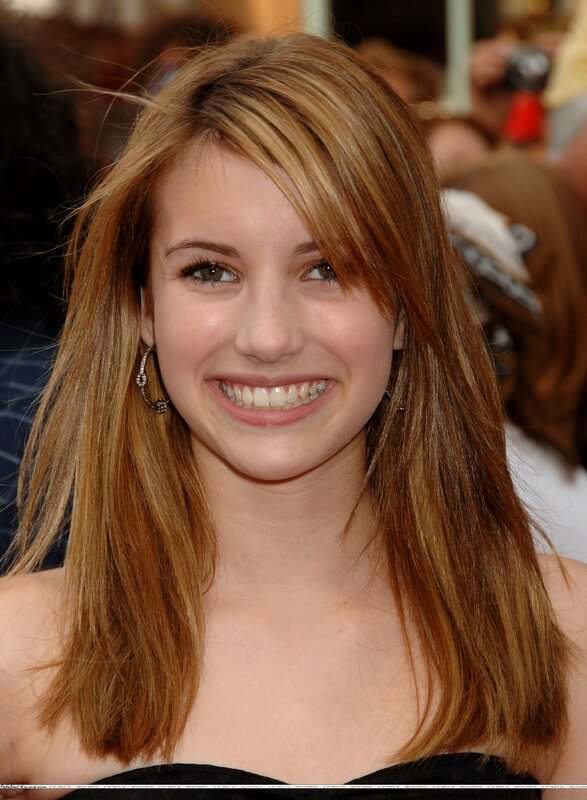 woman with long hair smiling