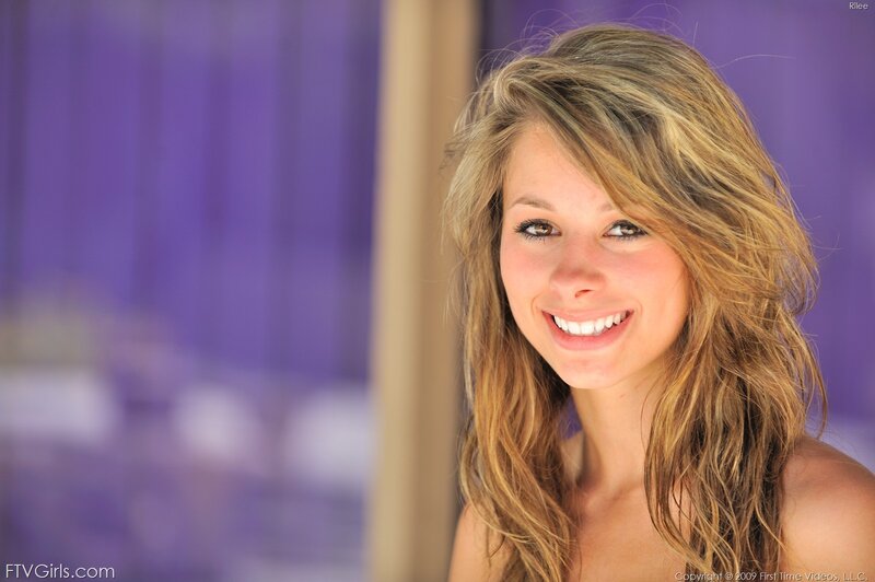 woman with long hair smiling