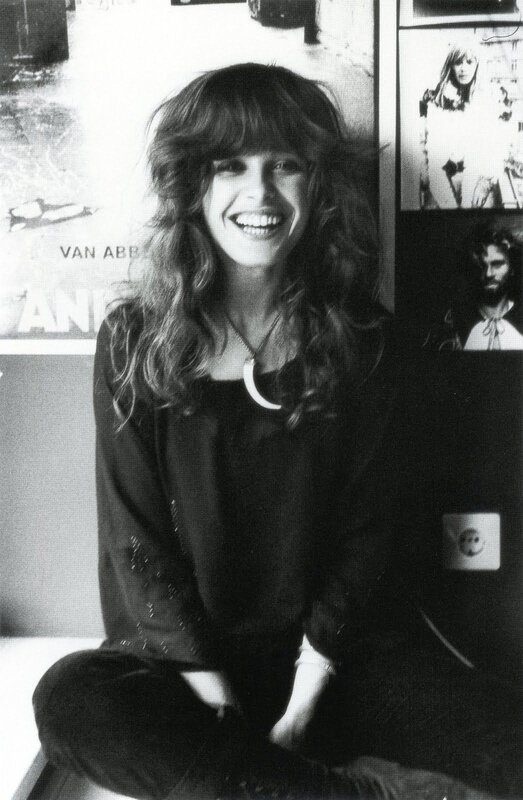 woman with long hair smiling