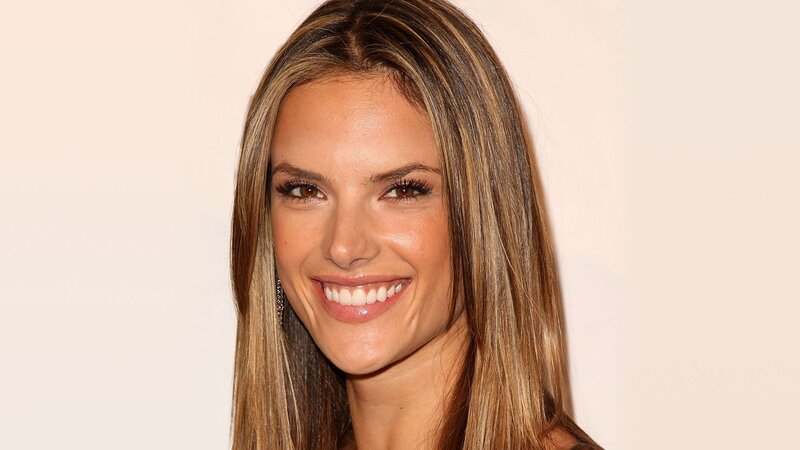 woman with long hair smiling
