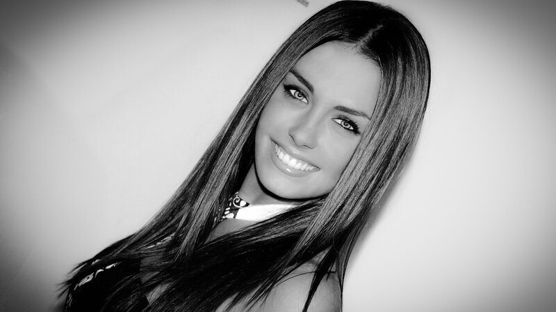 woman with long hair smiling