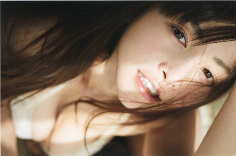 woman with long hair smiling