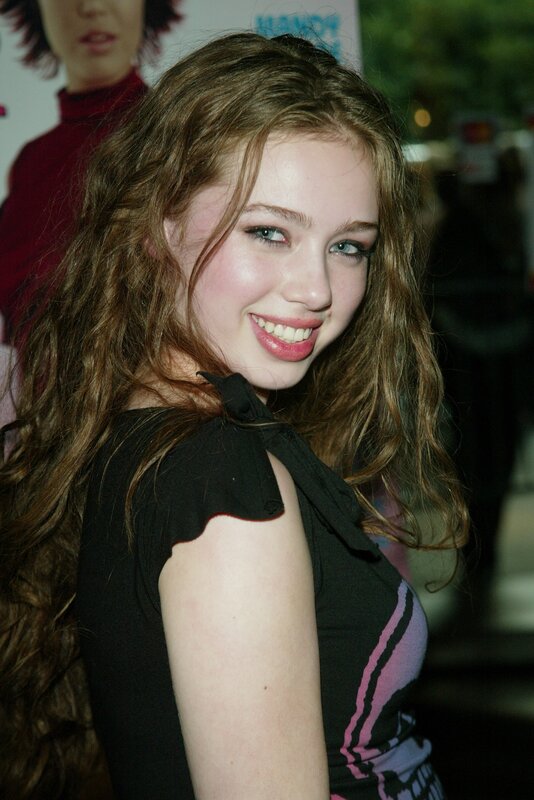 woman with long hair smiling